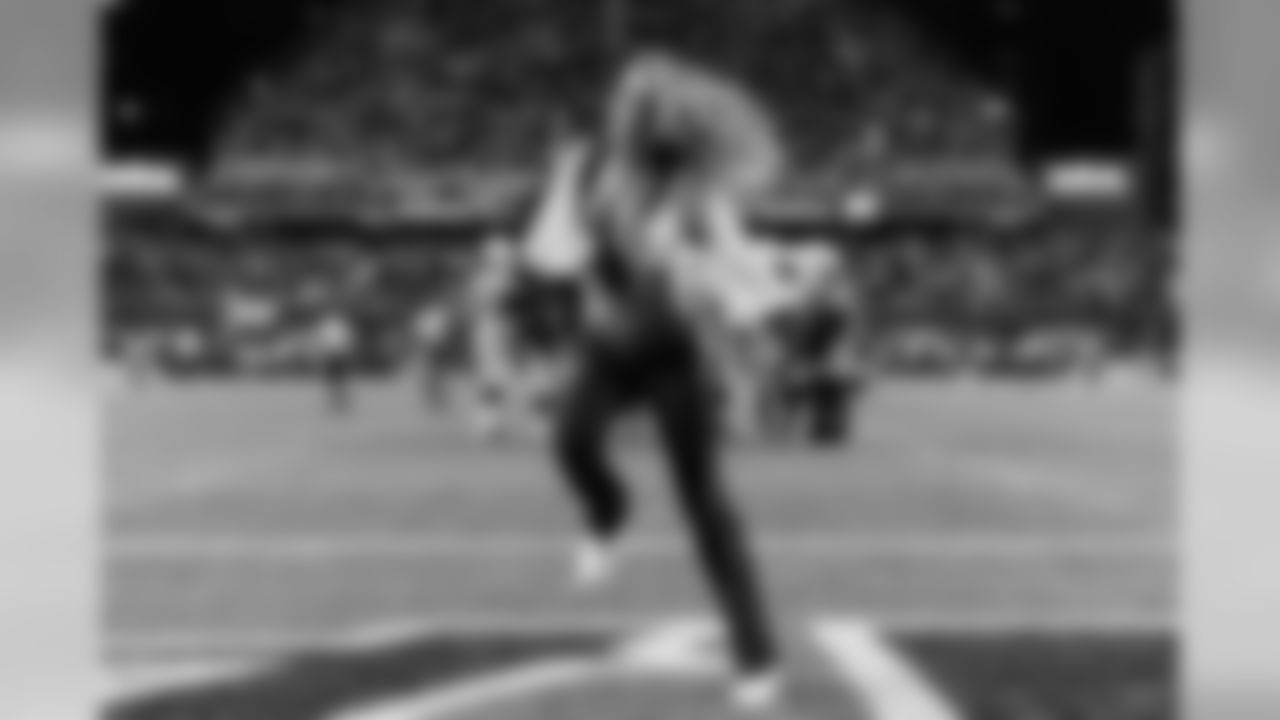 The Sea Gals perform on the field during a break in the fourth quarter.
