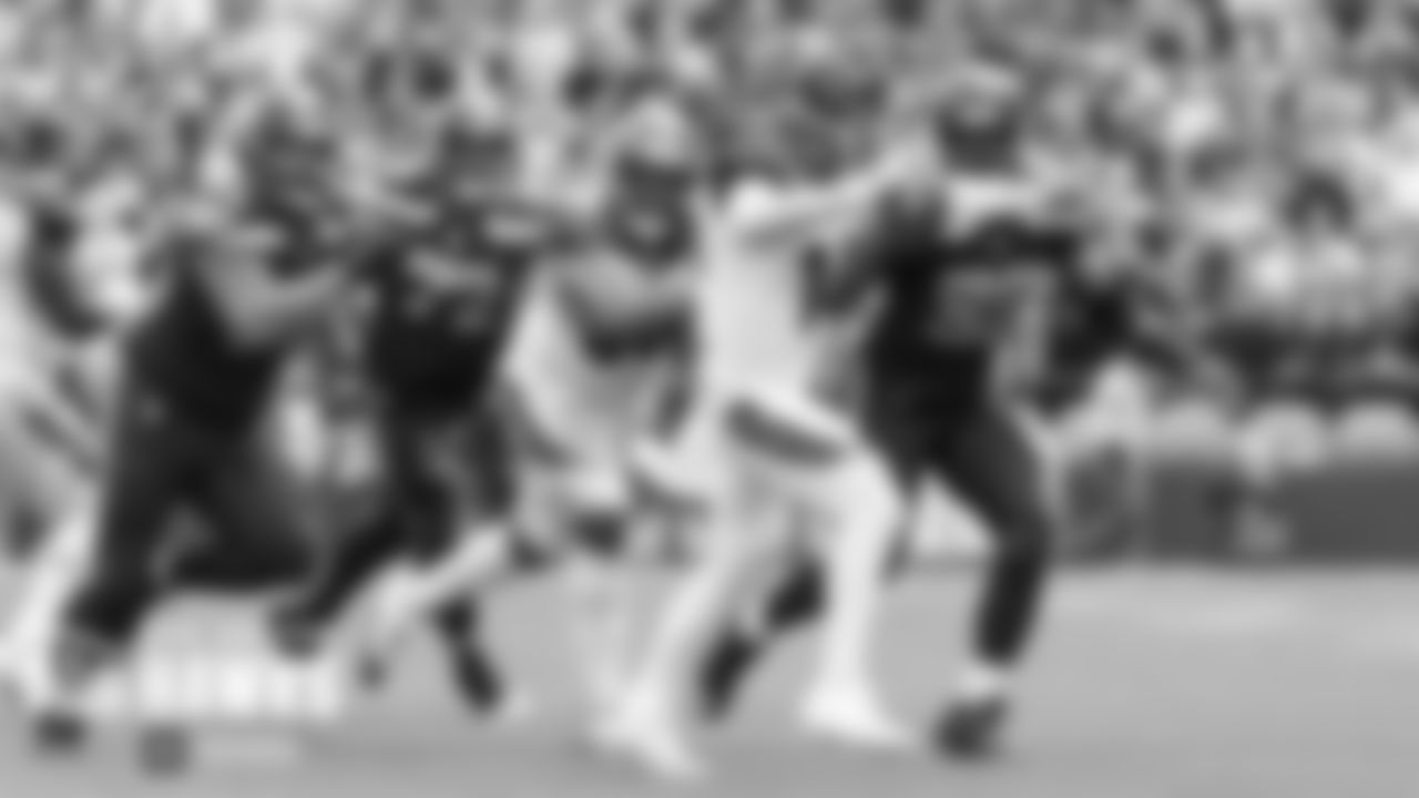 Seattle's defensive front pressures Bengals quarterback Andy Dalton late in the game. From left are Seahawks Bryan Mone, Al Woods and Rasheem Green.