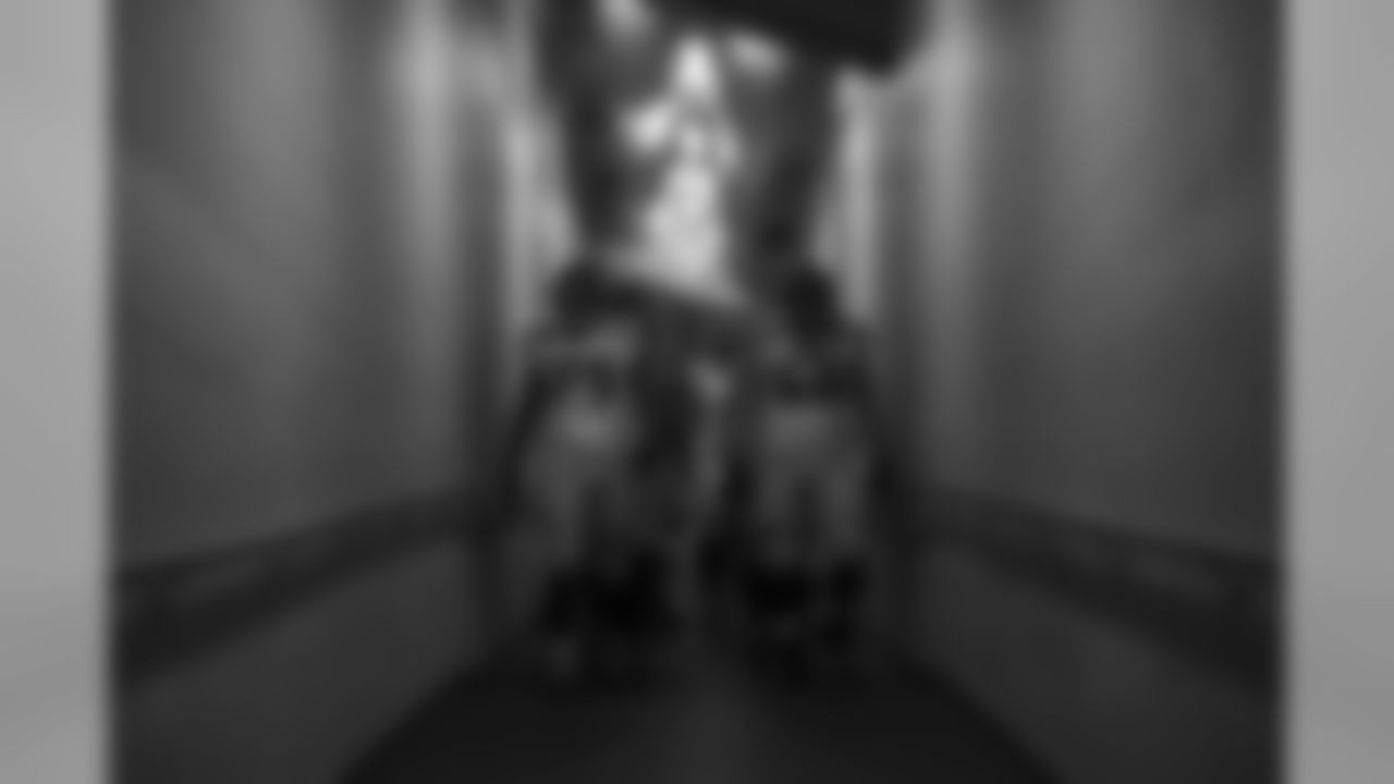 Offensive linemen Garry Gilliam and Justin Britt lead the way as the Seahawks make their way down a tunnel taking them from their locker room to the field.
