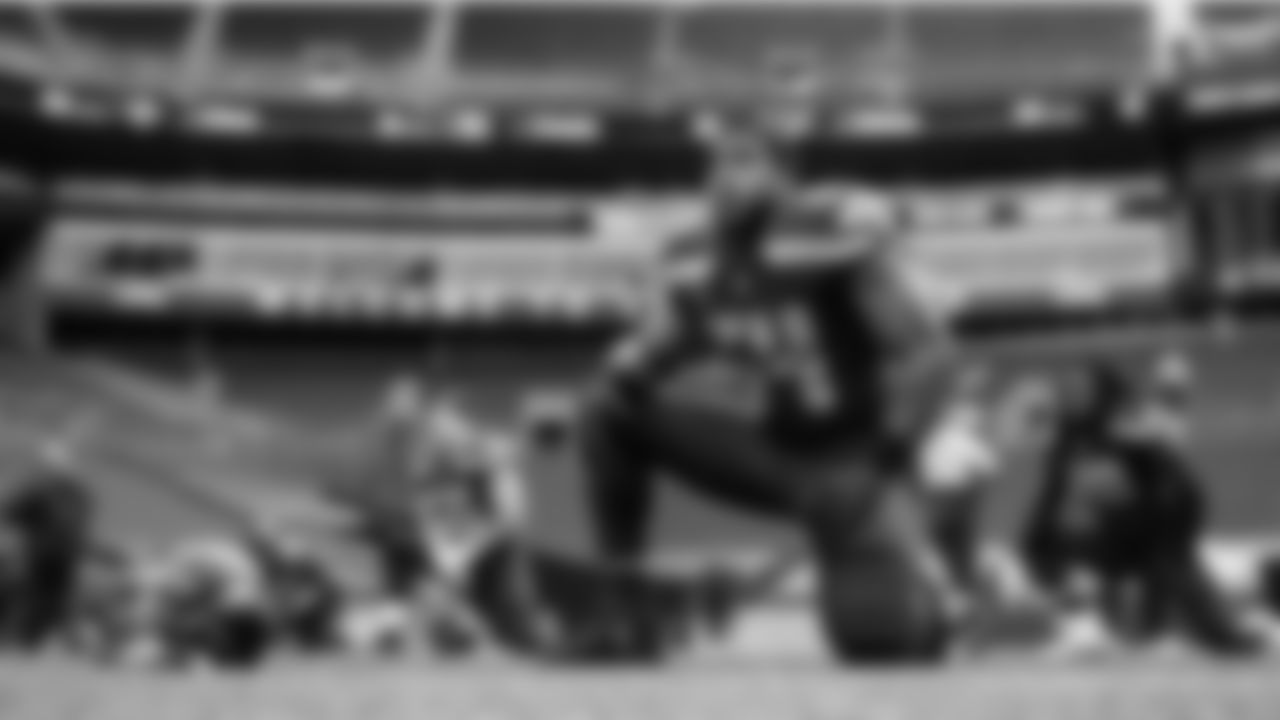 Seahawks defensive captain Bobby Wagner stretches with teammates prior to the game.