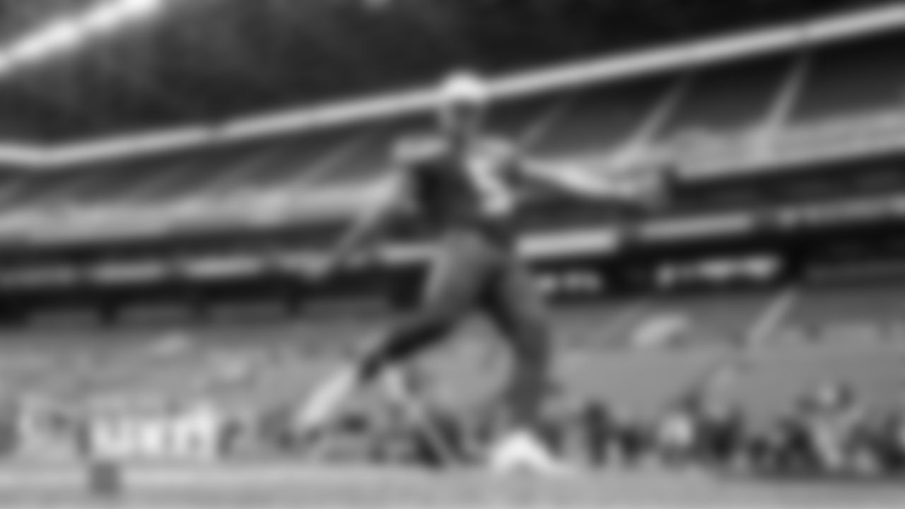 Seahawks kicker Jason Myers warms up in front of empty stands before the game.