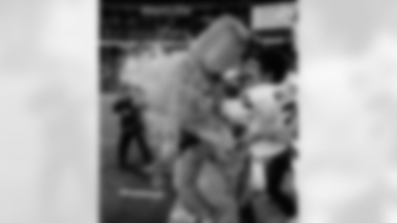 Quarterback Russell Wilson gives head coach Pete Carroll a Gatorade shower when it became clear that the Seahawls had won the Super Bowl.
