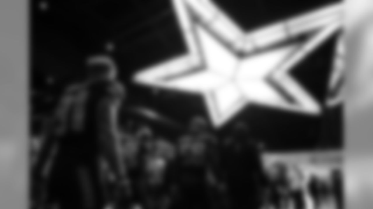 The Seahawks make their way from the locker room to the field and pass underneath a brightly-lit Texas star.