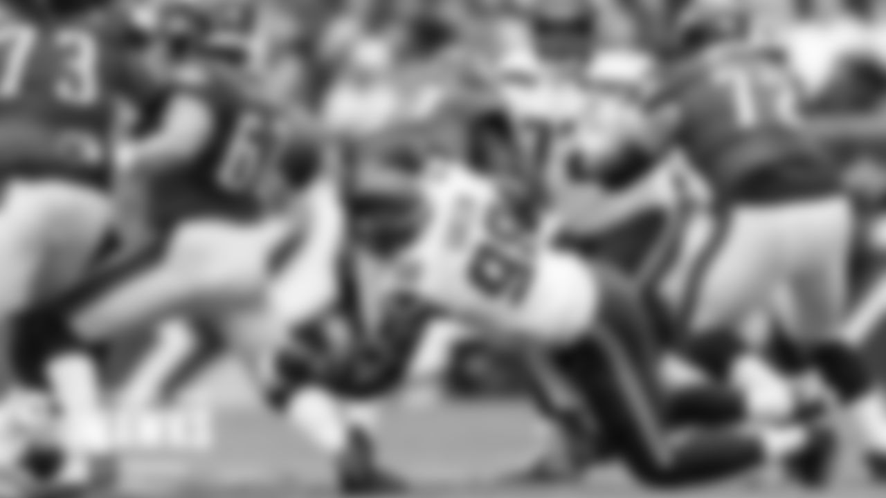 Seahawks defensive end Rasheem Green hits Eagles quarterback Carson Wentz and knocks the ball away for a fumble which was recovered by Seattle's Al Woods.