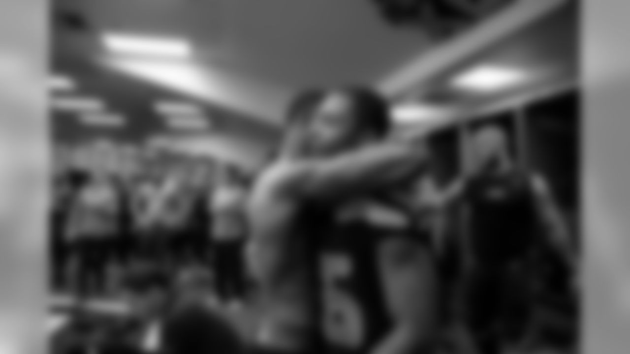 Seahawks receiver Tyler Lockett receives an embrace from teammate Paul Richardson in the locker room after the game.