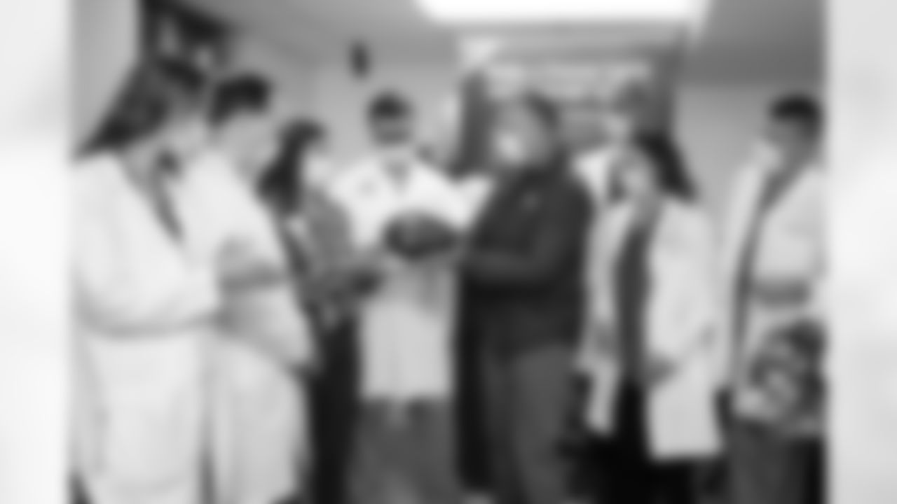 Seahawks linebacker Darrell Taylor helped deliver a game ball from the October 16 Crucial Catch game to the Virginia Mason Medical Center on November 1, 2022.