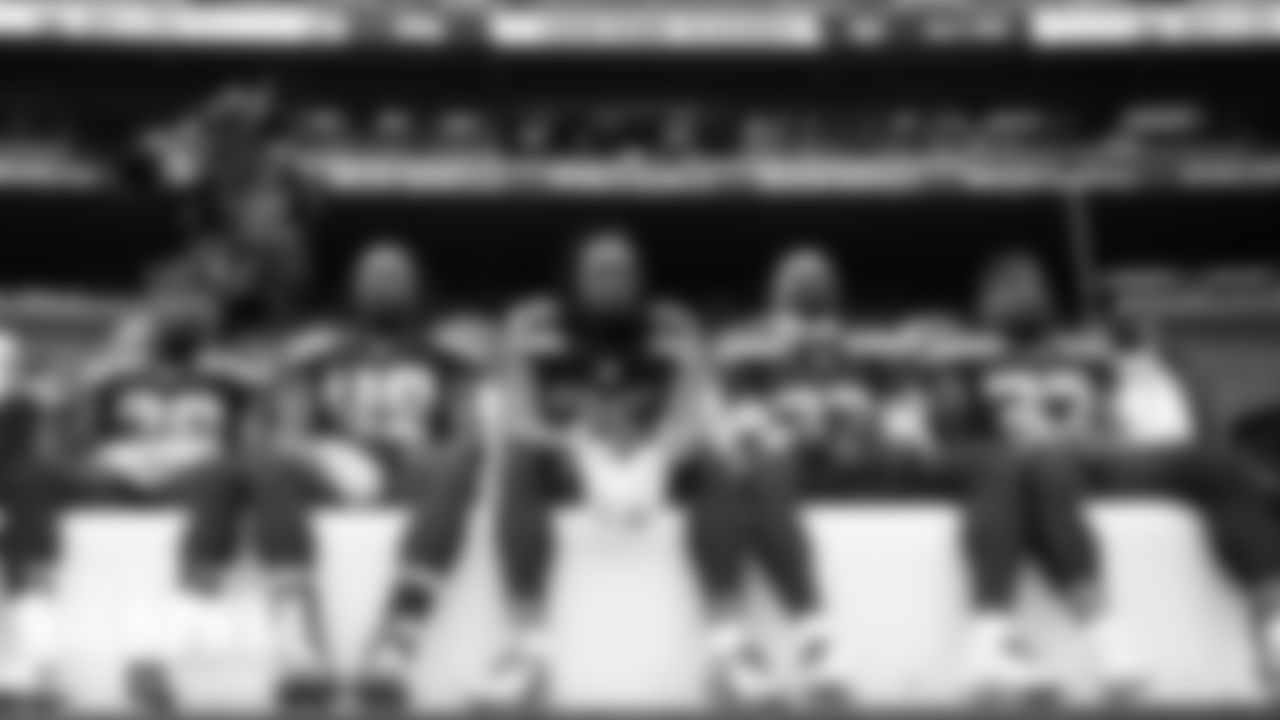 Seahawks defenders Ugo Amadi, Shaquem Griffin, Shaquill Griffin, Jamal Adams and Quandre Diggs wait on the bench before the performance of the national anthem.