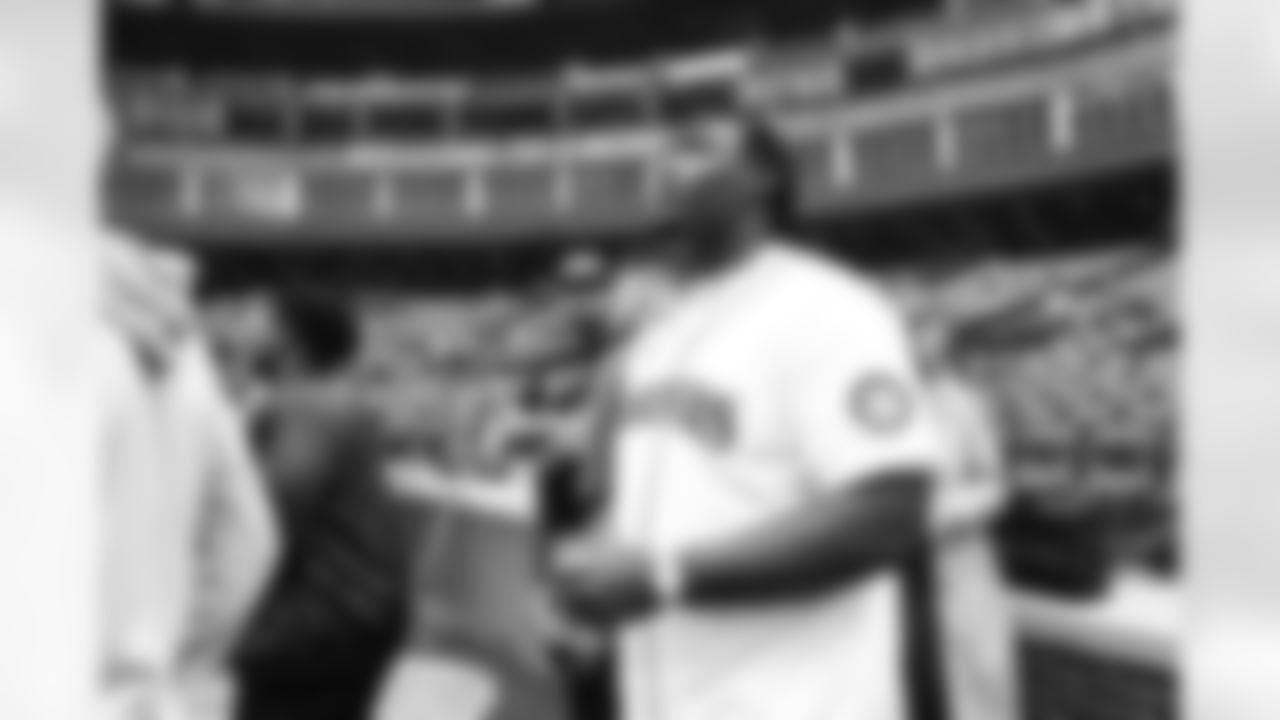 Seahawks first round pick Charles Cross throws out the ceremonial first pitch for the Seattle Mariners at T-Mobile Park on May 29, 2022.