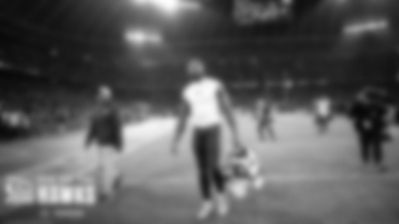 After the game, DK Metcalf walks off the field towards the locker room.