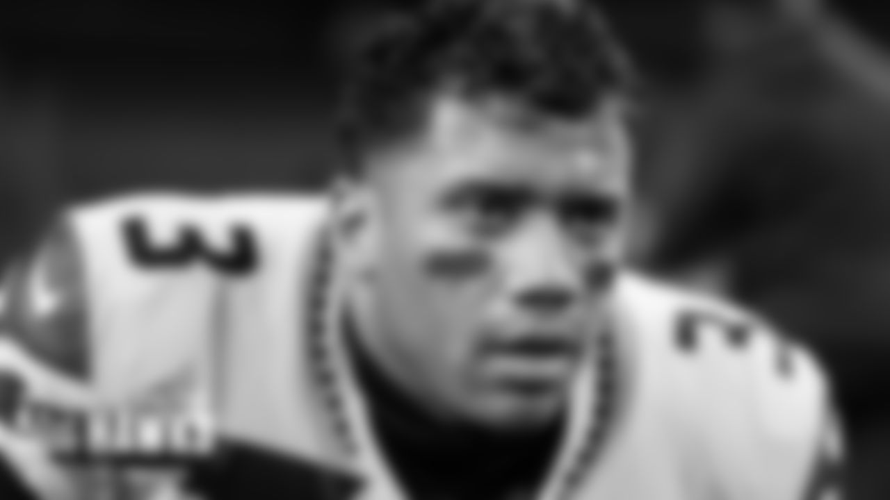 Seahawks quarterback Russell Wilson focuses during pregame stretching.