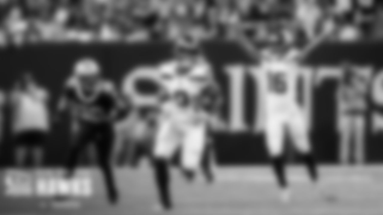 Seahawks running back Kenneth Walker III heads to the end zone on a 69-yard run as Tyler Lockett begins the celebration behind him.