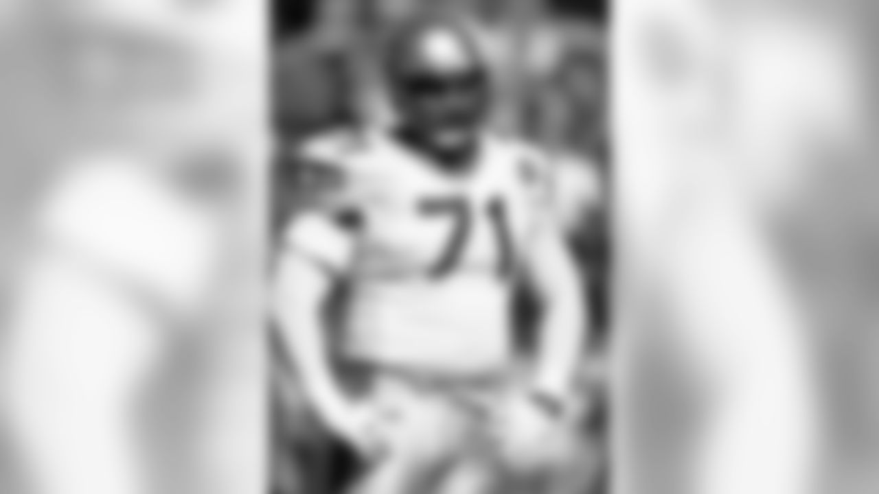 Seattle Seahawks offensive lineman Walter Jones (71) takes a breather during an NFL football game against the Oakland Raiders on Sunday, Oct. 22, 2000, in Oakland. The Raiders won the game, 31-3. (AP Photo/Greg Trott)