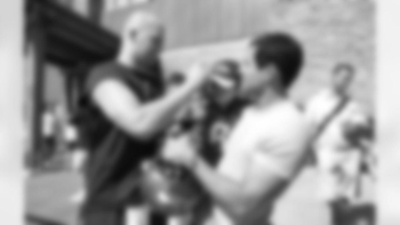 Matt Hasselbeck signs an autograph for the Bachelor and his son