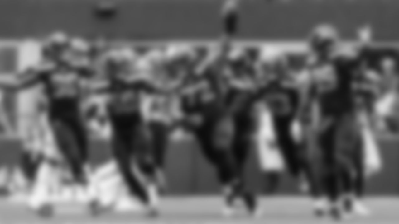 Seattle's Al Woods celebrates his interception with teammates Rasheem Green, K.J. Wright, Tedric Thompson and Quinton Jefferson.