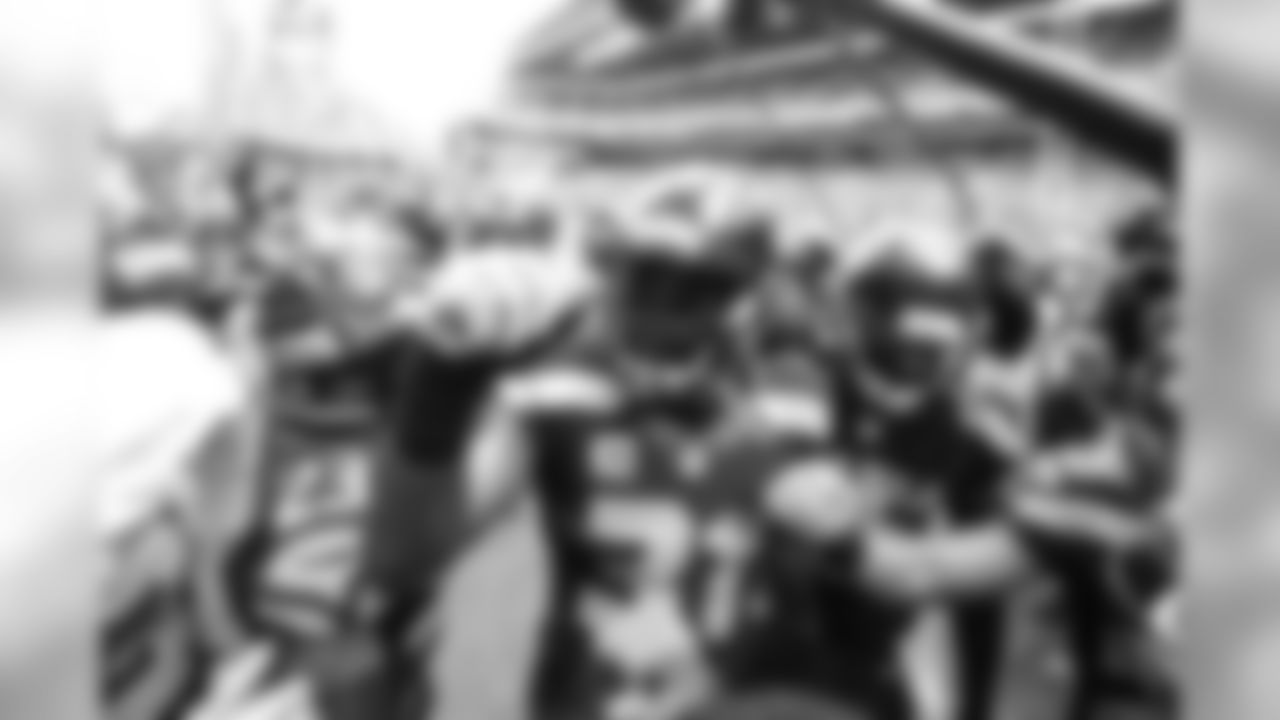 Defensive captain Kam Chancellor gathers the defensive backs for their traditional huddle before taking the field as the fans slowly begin to filter into CenturyLink Field.