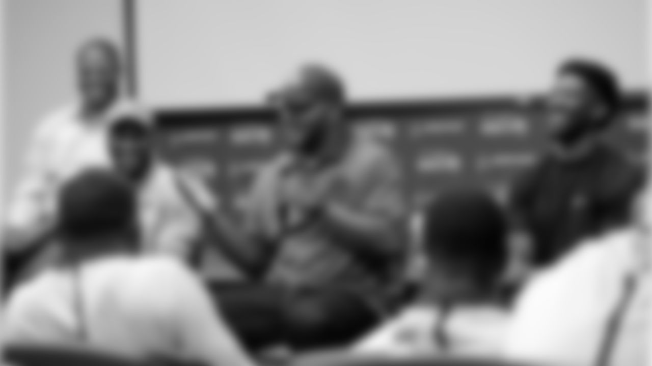 Former Seattle Seahawks' Walter Jones, center, address rookies during a panel discussion with Bruce Fisher, left, Jordan Babineaux and Marcus Trufant, right, at the football team's training camp Monday, June 20, 2016, in Renton, Wash. The team is holding a rookie symposium for the new players to give them information about the NFL. (AP Photo/Elaine Thompson)