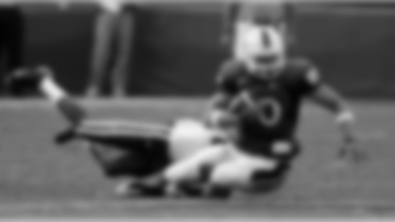 Miami's Jimmy Graham (80) is tackled by Duke safety Matt Daniels during the quarter of an NCAA college football game in Miami, Saturday, Nov. 21, 2009. (AP Photo/Alan Diaz)
