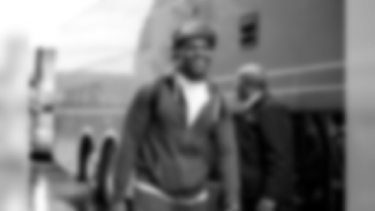 Seahawks defensive end Cliff Avril sports a winter-ready hat as he boards the bus to begin the trip to Philadelphia.