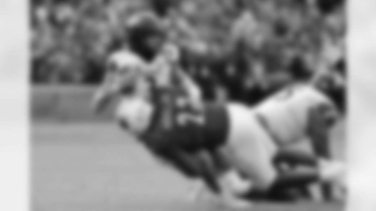 Cincinnati quarterback Evan Prater is sacked by Louisville's Yasir Abdullah during the second quarter of the Fenway Bowl NCAA college football game at Fenway Park Saturday, Dec. 17, 2022, in Boston. (AP Photo/Winslow Townson)