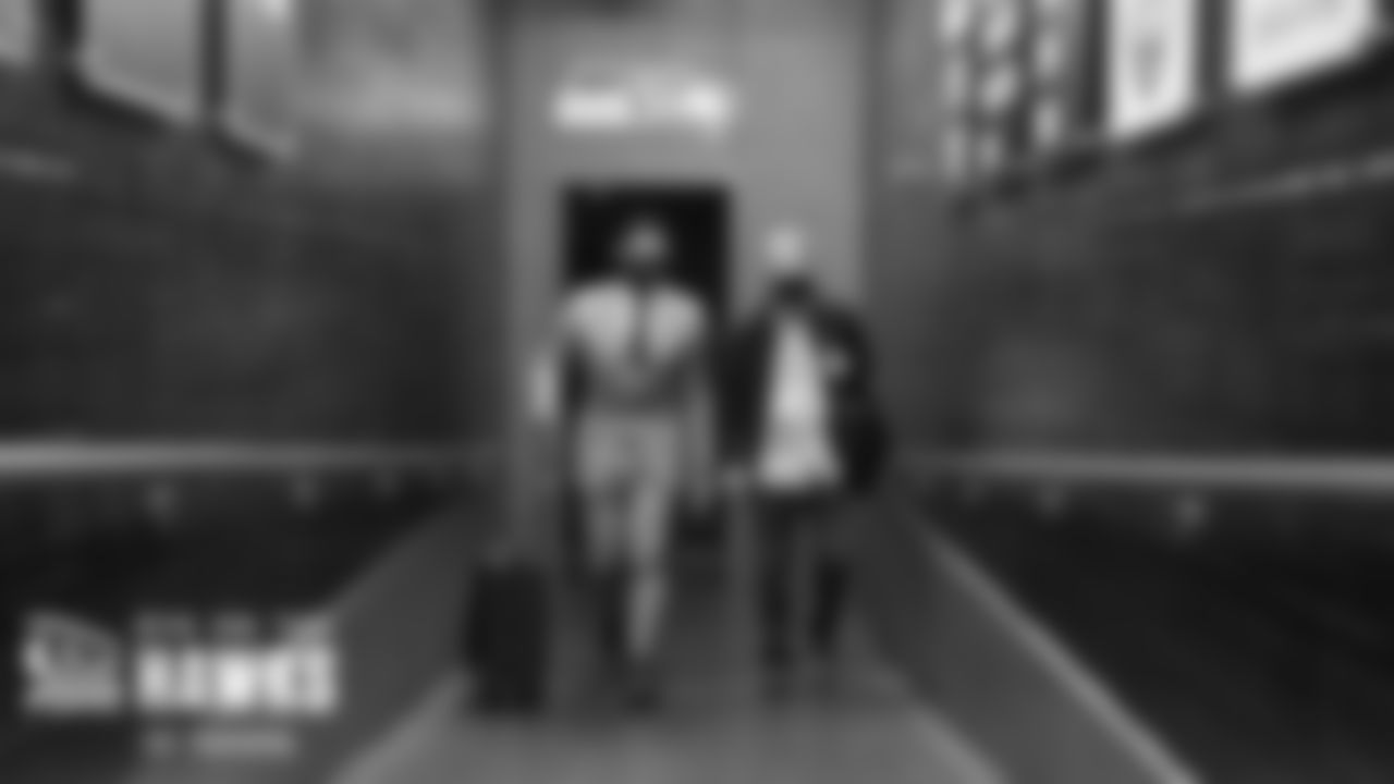 Seahawks quarterback Russell Wilson and assistant coach Carl "Tater" Smith arrive at Lumen Field for the Week 2 matchup with the visiting Tennessee Titans.