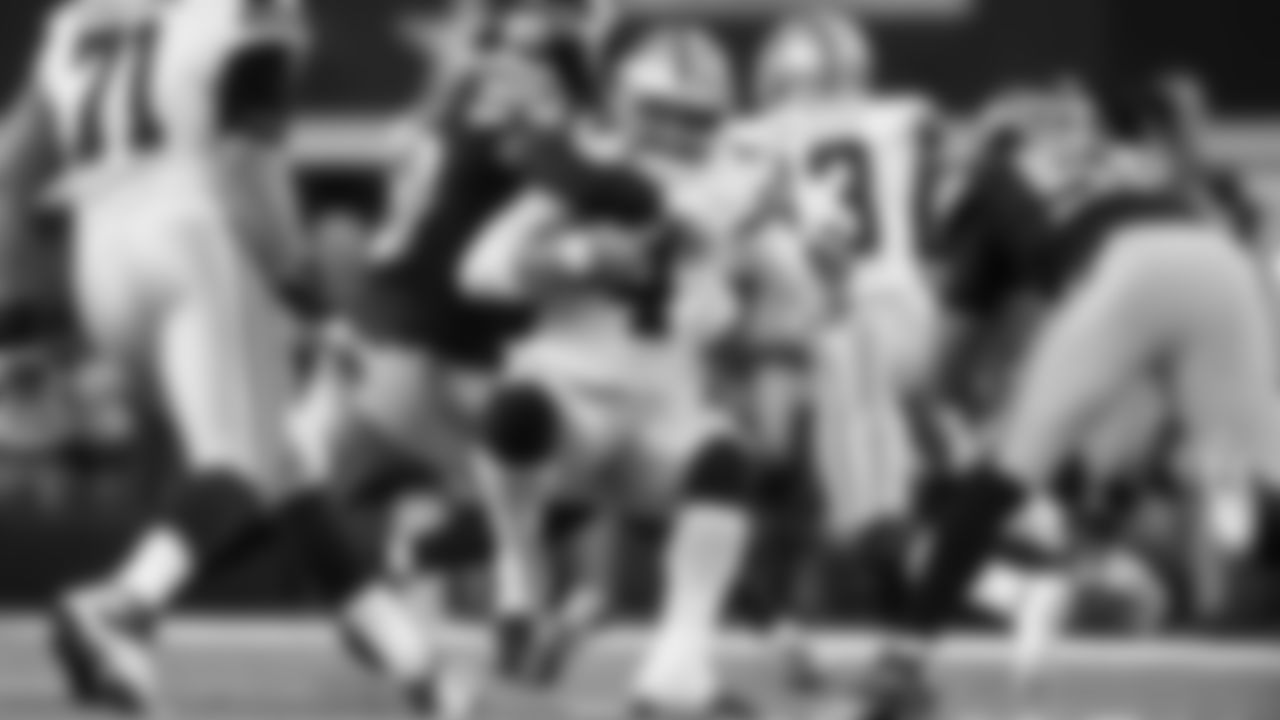 Seattle's Jacob Martin brings down Dallas quarterback Dak Prescott.