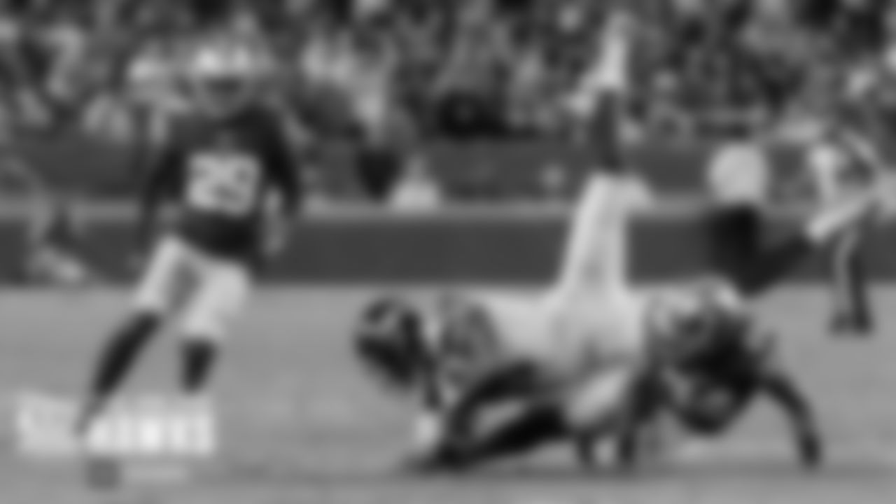Seahawks receiver DK Metcalf is upended after a reception in the first half.