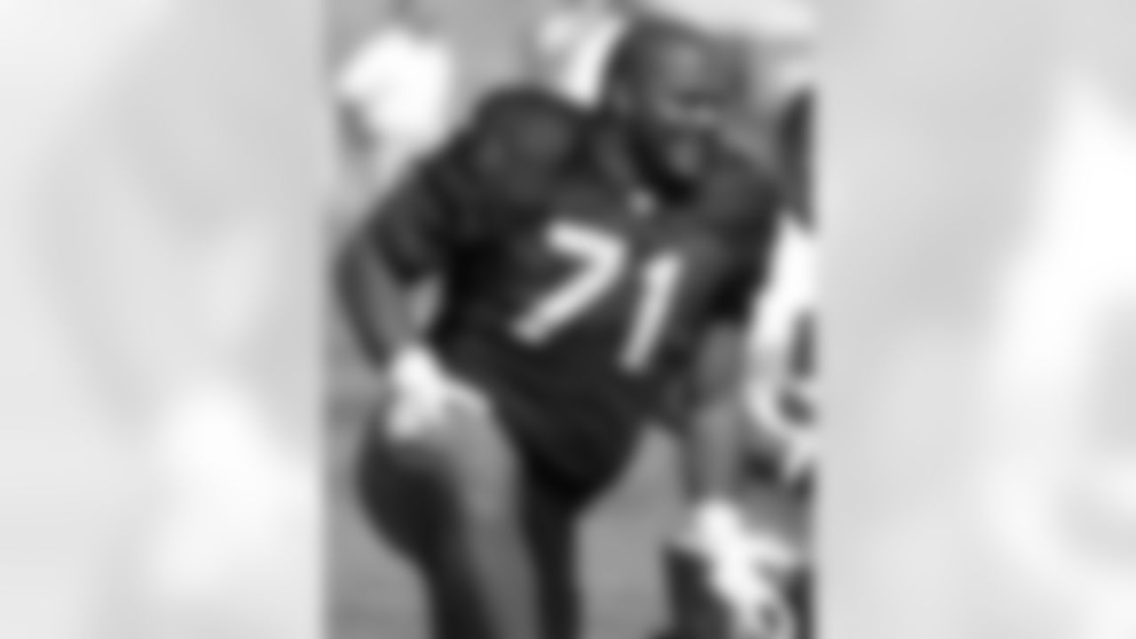 Seattle Seahawks offensive tackle Walter Jones smiles along the sidelines during football training camp, in this Aug. 15, 2006 file photo, at Eastern Washington University in Cheney, Wash. Cynics snicker over Jones' and Jonathan Ogden's well-worn path to the Pro Bowl. They say the 33-year-old left tackles for the Seahawks and Ravens, respectively, are going on reputation, not merit. (AP Photo/Jim Bryant, file)