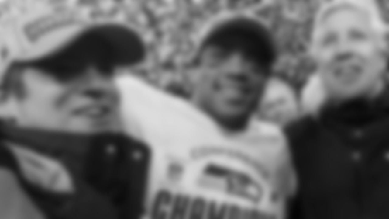 As the confetti rained down upon them quarterback Russell Wilson celebrated the victory 23-17 win over San Francisco and resulting trip to the Super Bowl with general manager John Schneider and head coach Pete Carroll.