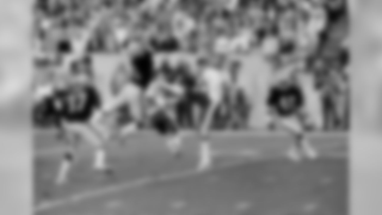 Los Angeles Raiders Derrick Jensen sails through the air as he blocks a punt by Washington Redskins Jeff Hayes during first quarter action in Super Bowl XVIII in Tampa, Fla., Jan. 22, 1984. The ball, visible at upper right, was recovered by the Raiders in the endzone for the first score of the game. The Raiders went on to win 38-9. (AP Photo)