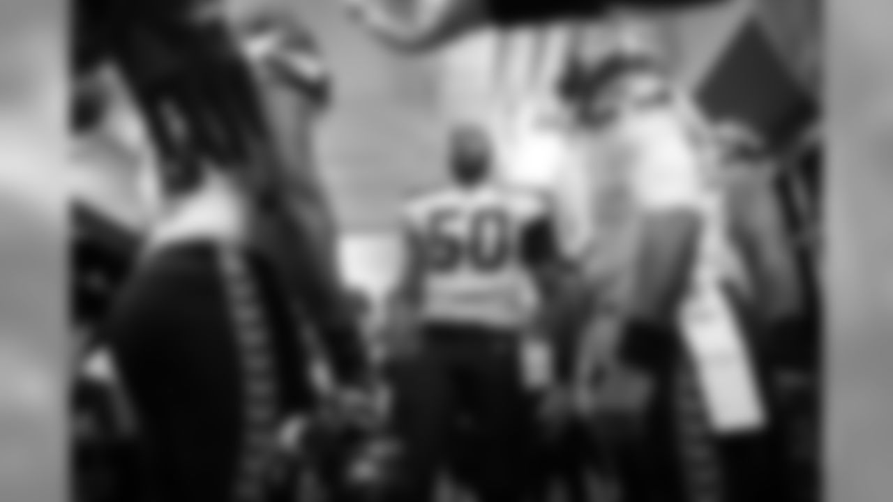 Linebacker K.J. Wright, playing for the first time in the regular season, talks to the team before kickoff.