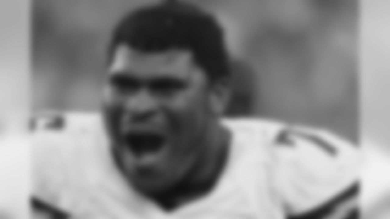 San Diego Chargers offensive tackle D.J. Fluker watches from the sidelines in the second half of an NFL wild-card playoff football game against the Cincinnati Bengals Sunday, Jan. 5, 2014, in Cincinnati. (AP Photo/Tom Uhlman)