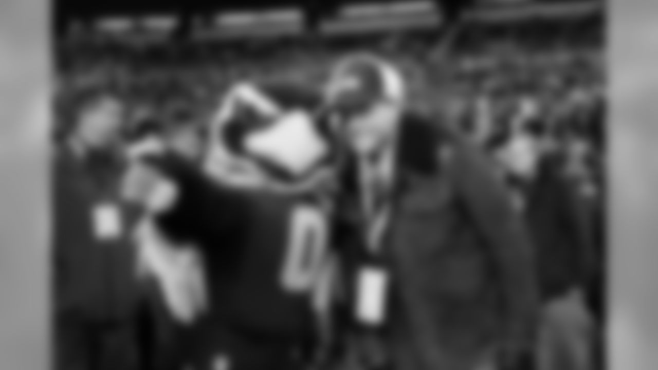 Seahawks mascot "Blitz" chats with television personality Joel McHale before the game. McHale was raised in Seattle and is an avid 12.