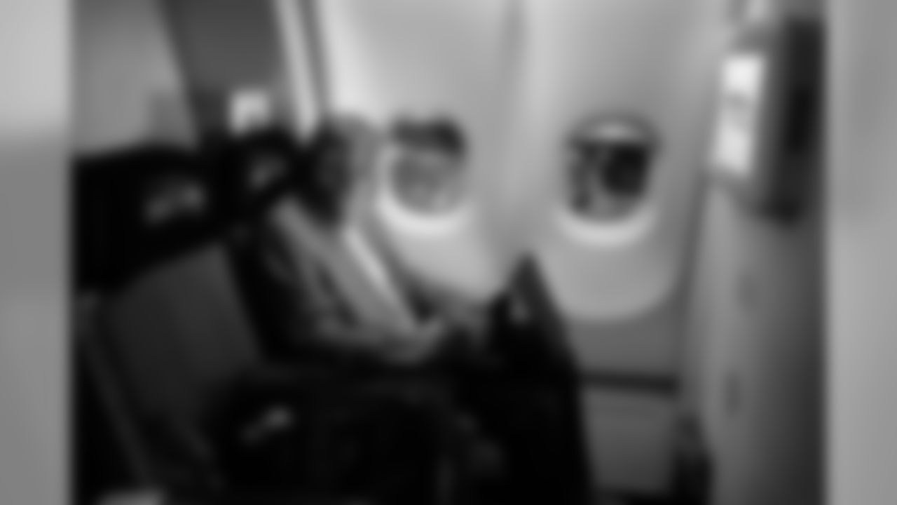 Head coach Pete Carroll took a seat behind his players and was watching game film before the plane took off from Charlotte for the long flight home.