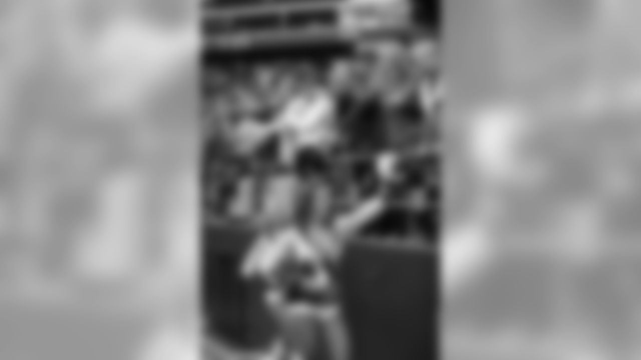 Karley high fiving 12s after a Seahawks touchdown. Karley does many promotional events in the community on a weekly basis where she is able to get to know fans from all over the area.