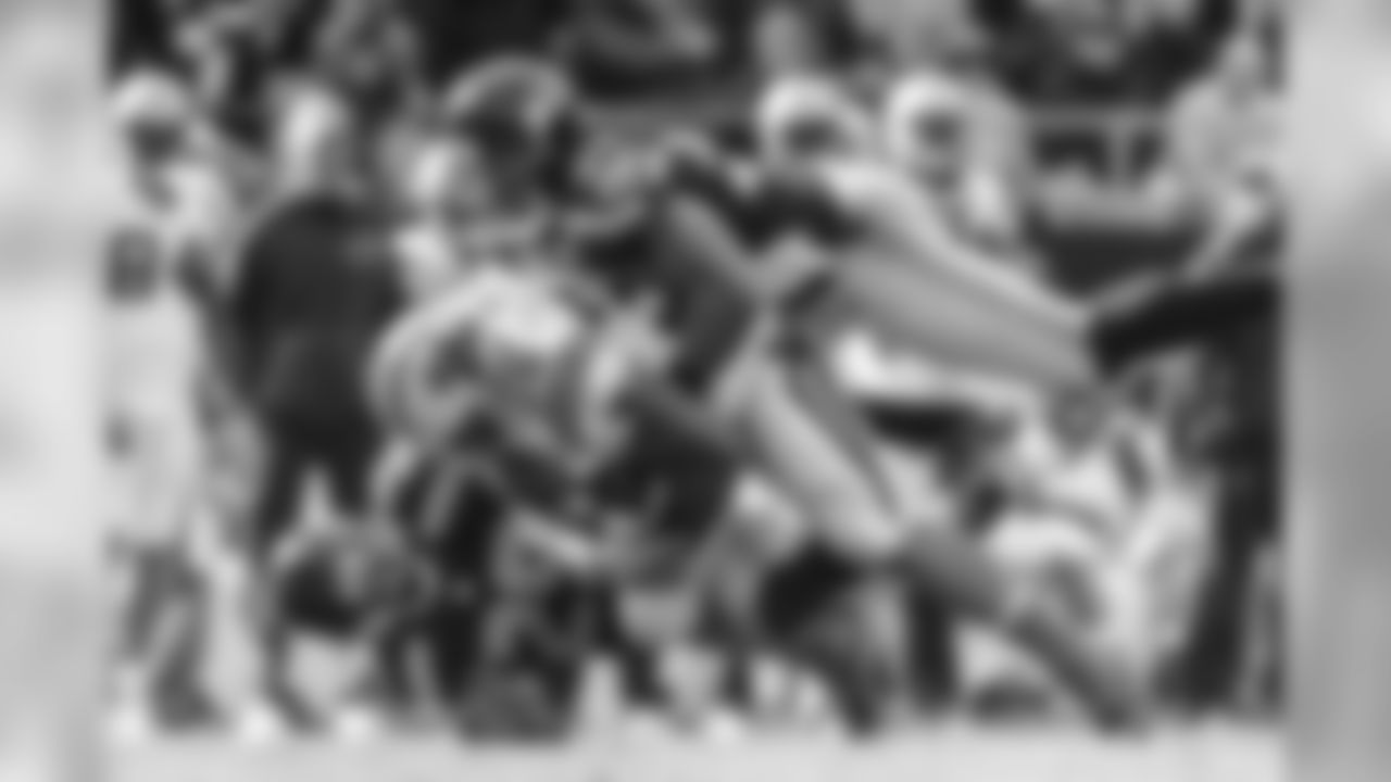 Seattle's Bobby Wagner flies into finish a tackle with Earl Thomas as they stop Carolina's Mike Tolbert.
