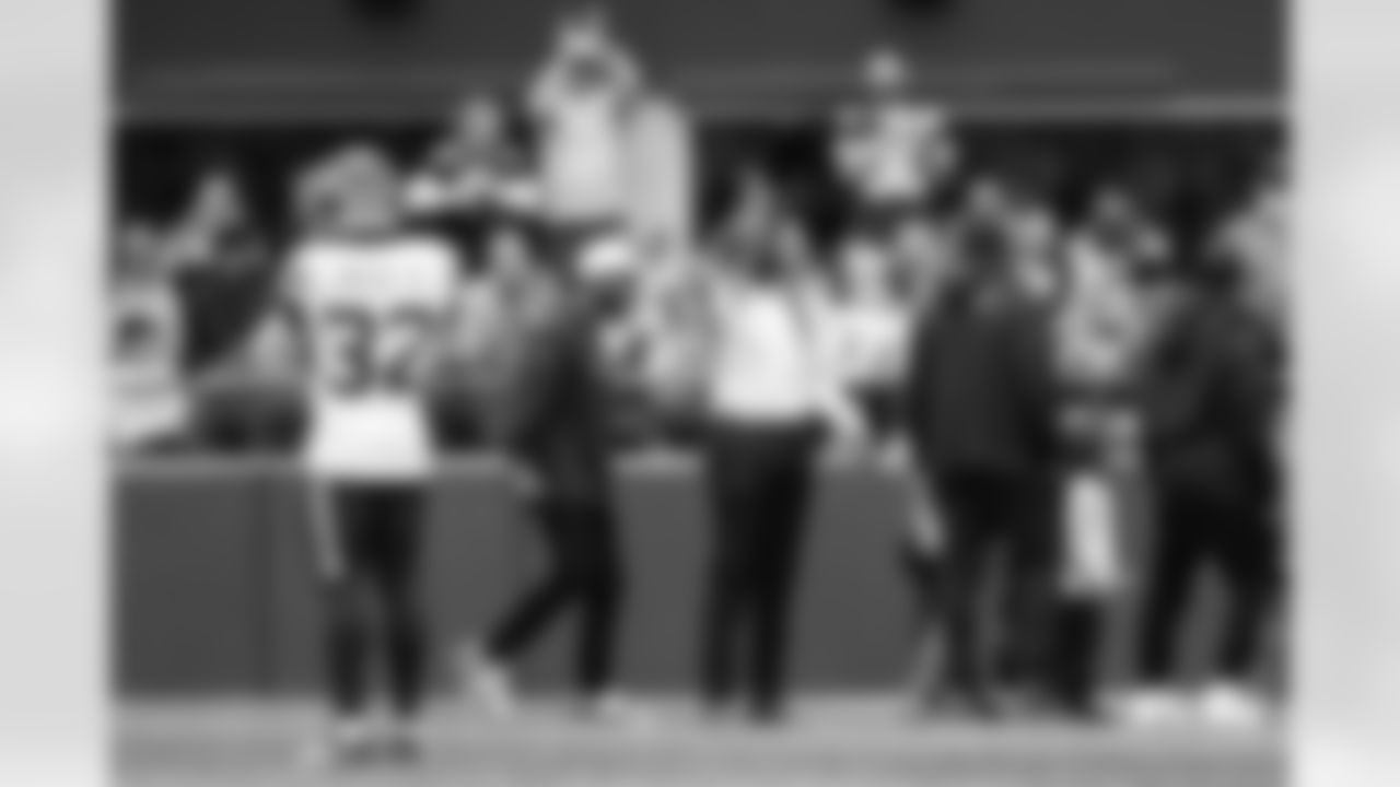 Seahawks legend Sidney Rice joins other members of the Super Bowl XLVIII team including Golden Tate (left) in acknowleging current players during a break in the action.