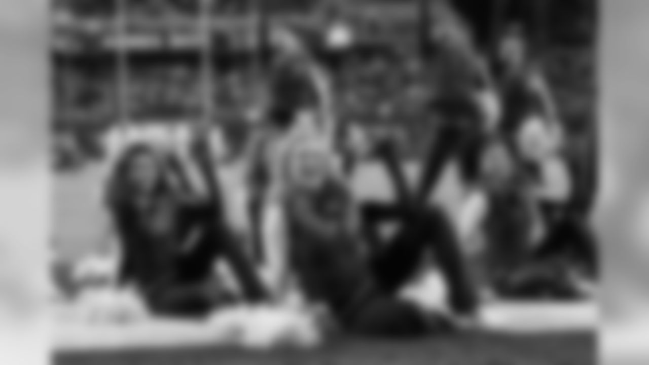 The Sea Gals perform in the south end zone between quarters.