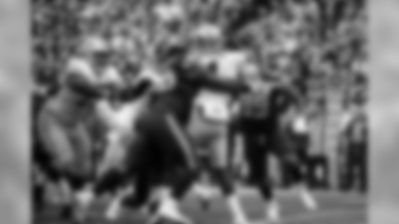 Seahawks defensive lineman Jarran Reed hits San Francisco's Nick Mullen.