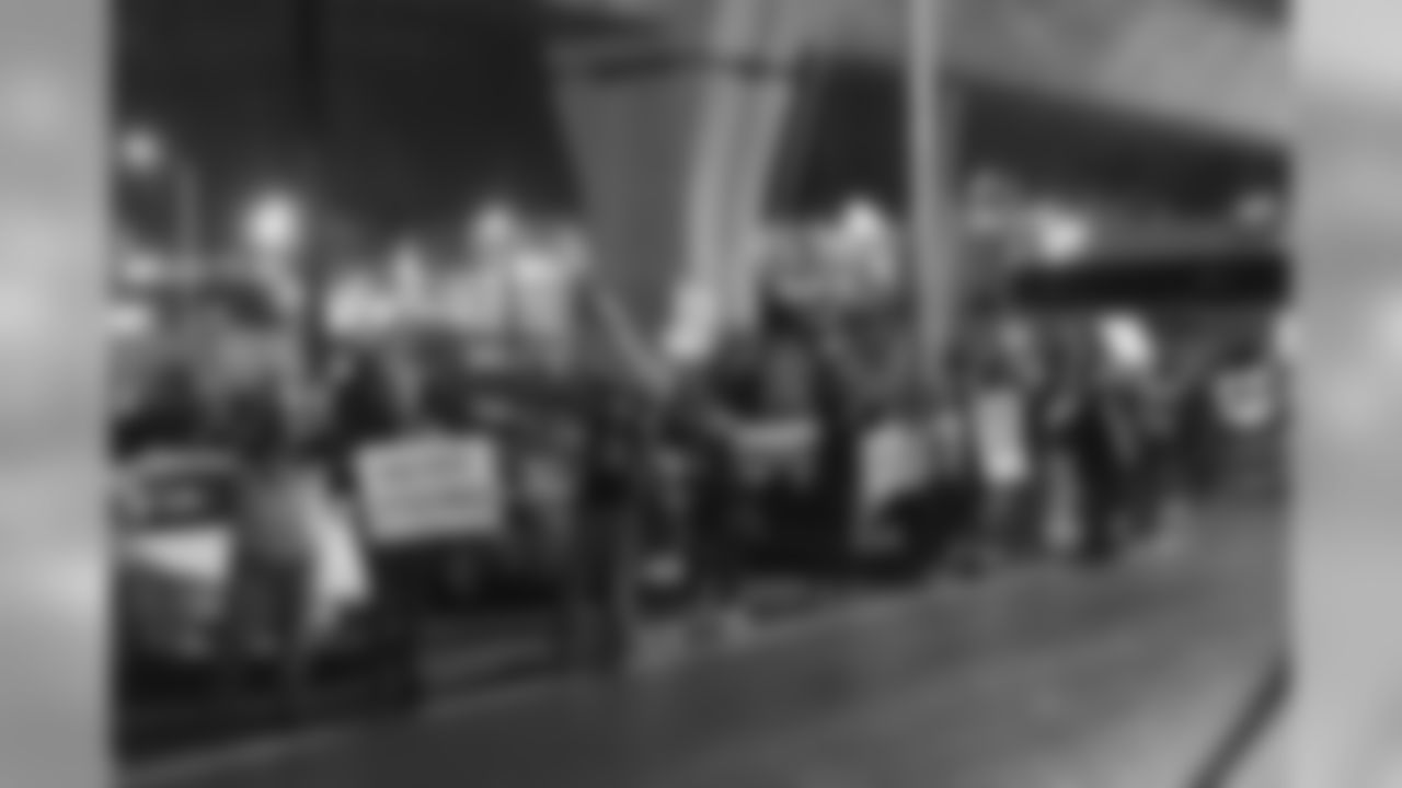 12s lined the streets to greet the team and show their support on Sunday night after the plane landed back in Seattle.