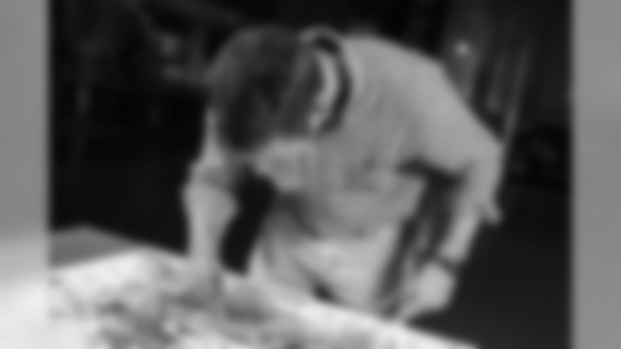 Jon Norquist from Coffee on Canvas (CoffeeOnCanvas.com) creates a piece of artwork for the Seahawks schedule release.