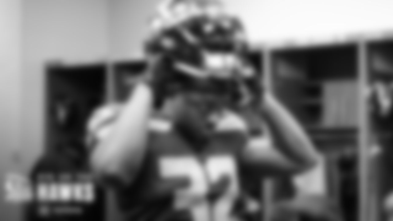 Newly acquired running back Tony Jones, Jr., puts on his helmet and heads to the field.