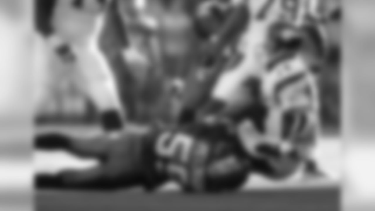 Minnesota Vikings quarterback Brad Johnson is sacked by Seattle Seahawks' Julian Peterson to end the second quarter in a football game in Seattle, Sunday, Oct. 22, 2006. (AP Photo/John Froschauer)