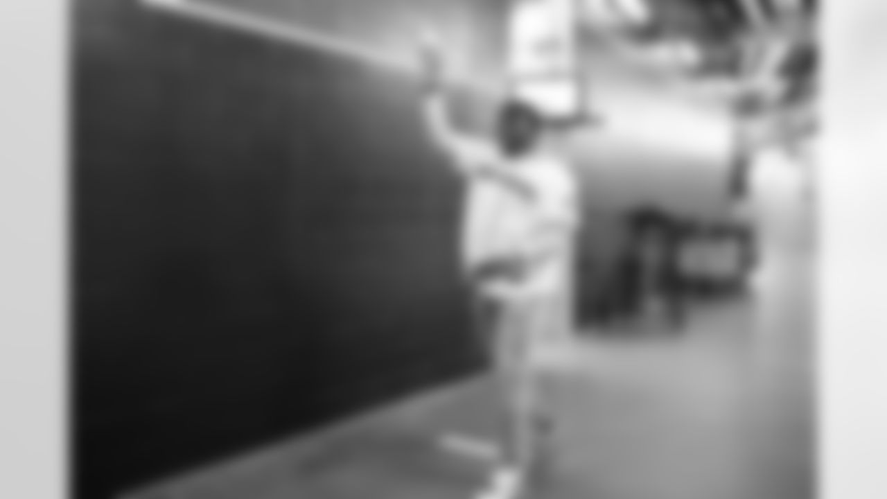 Seahawks first round pick Charles Cross throws out the ceremonial first pitch for the Seattle Mariners at T-Mobile Park on May 29, 2022.