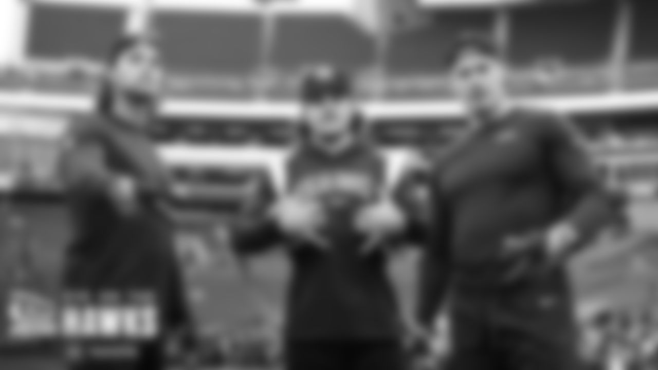 LInebackers Tanner Muse, Jon Rhattigan and Cody Barton pose during pregame.