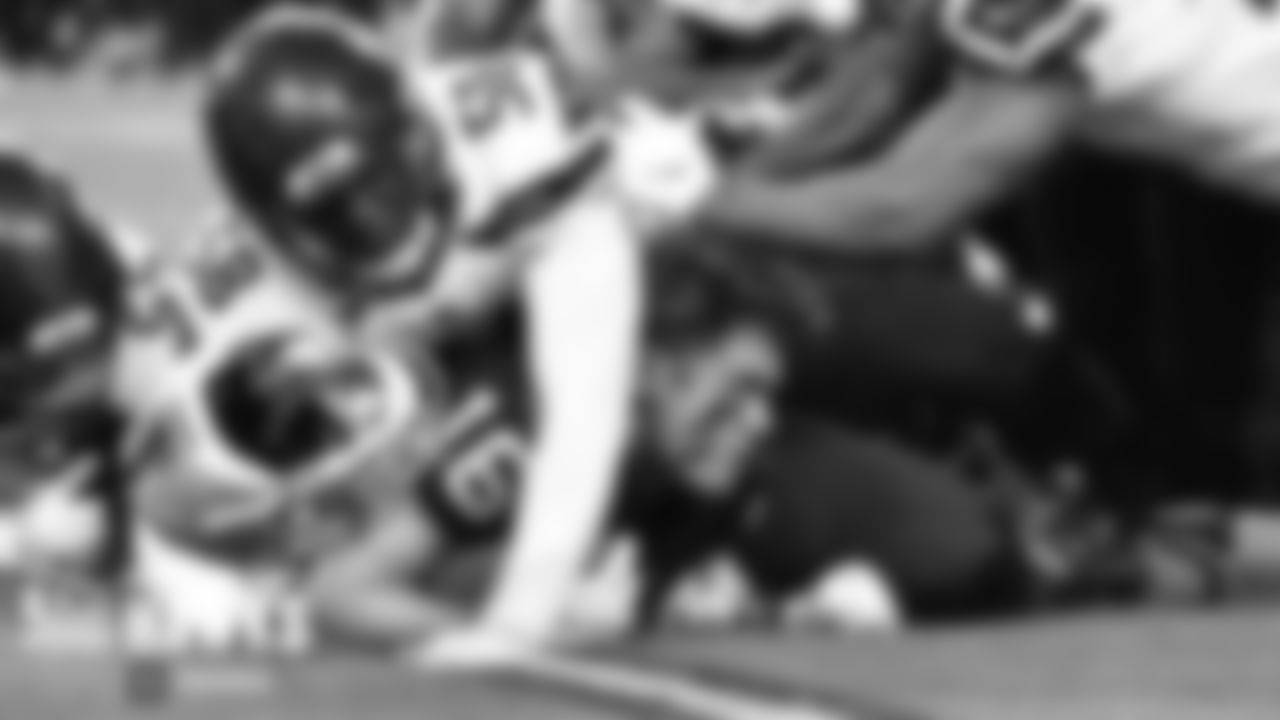 Seahawks defenders cause a Raiders player to lose his helmet in the second half.