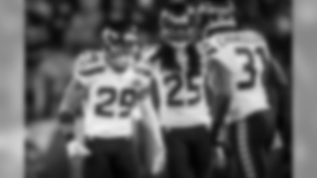 Safety Earl Thomas and cornerback Richard Sherman are fired up after Kam Chancellor's big hit on Denver's Demaryius Thomas.
