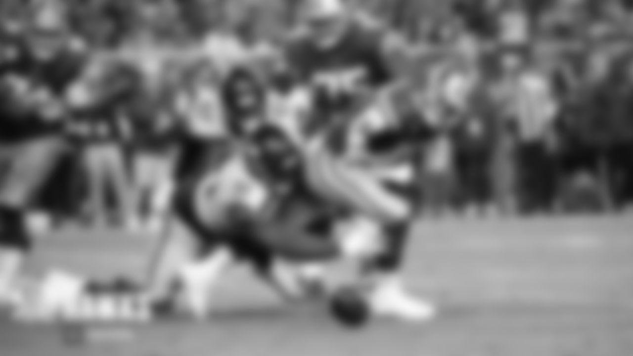 Seahawks defensive tackle Jarran Reed strips the ball away from 49ers quarterback Jimmy Garoppolo as SeattleÕs Poona Ford closes in.