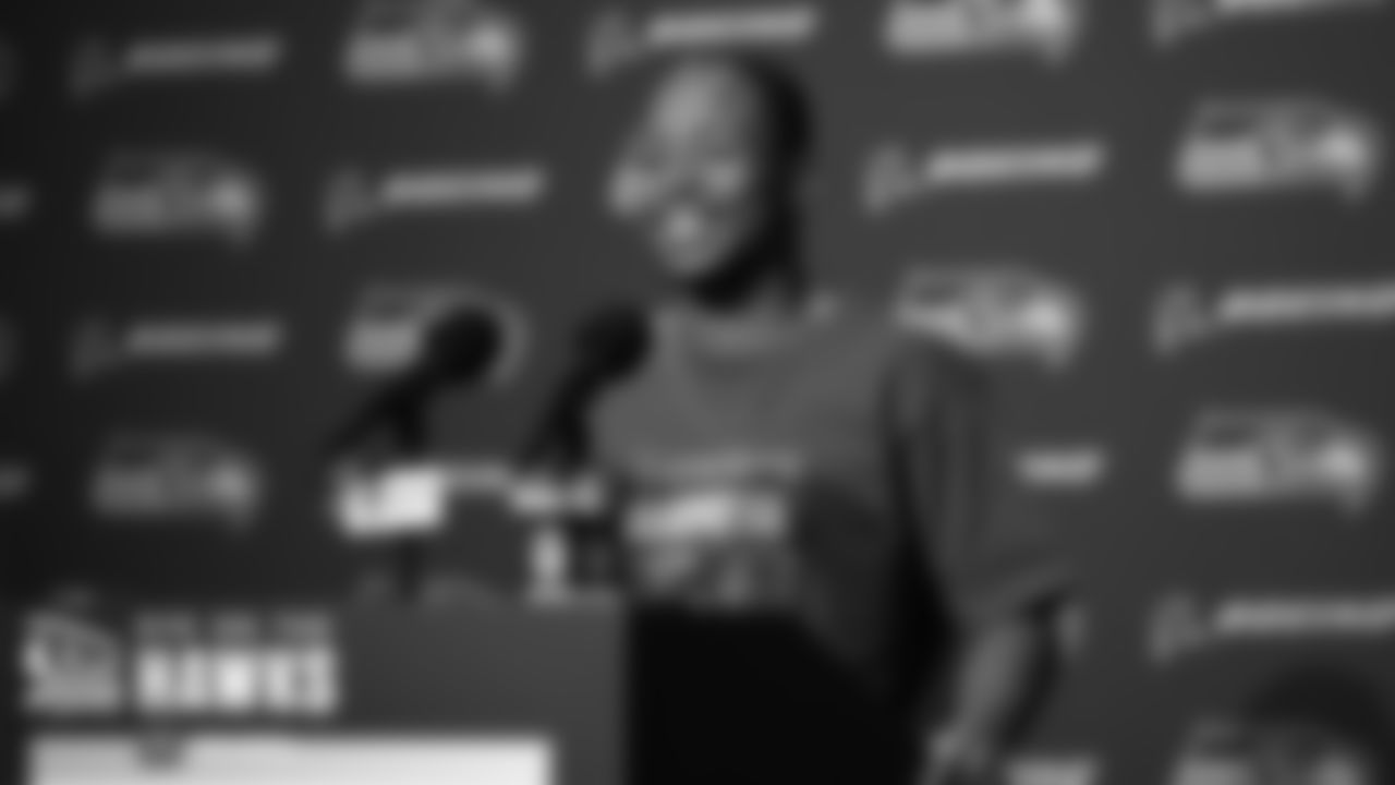 Seahawks receiver Tyler Lockett is all smiles at the podium during his postgame press conference.