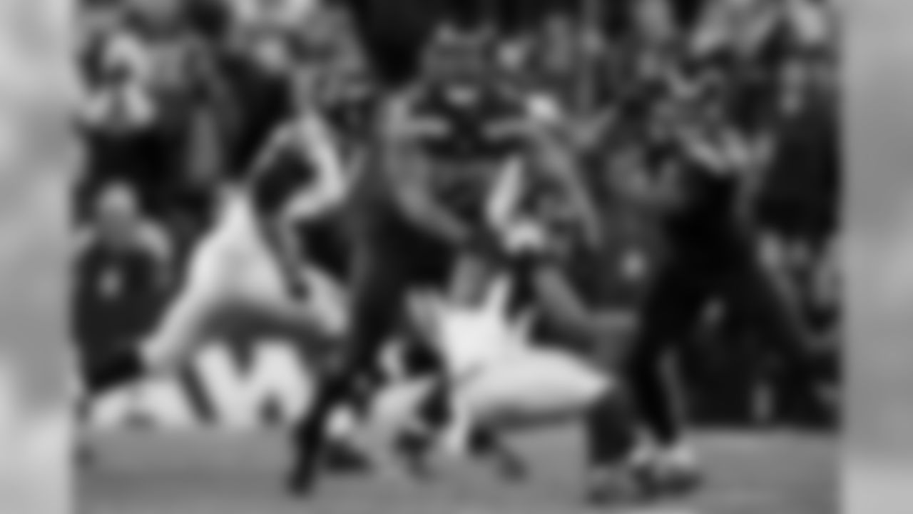 Seattle's Michael Bennett tackles Atlanta's Terron Ward for a loss.