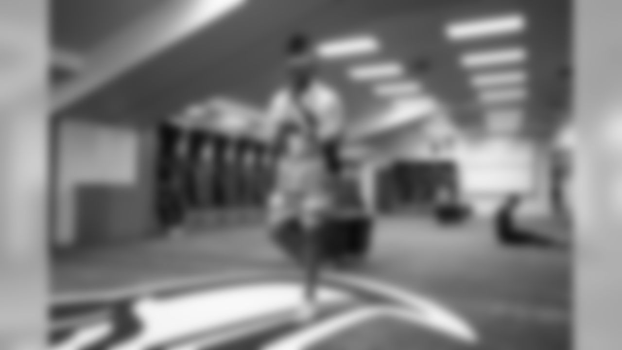 Receiver Brandon Marshall walks into the Seahawks locker room Sunday morning.